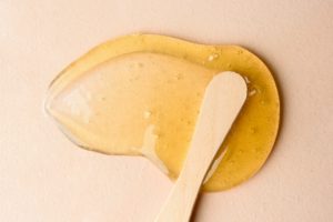 Liquid sugar wax smear with spatula