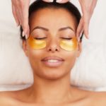 Young Woman Enjoying Facial Care in Spa